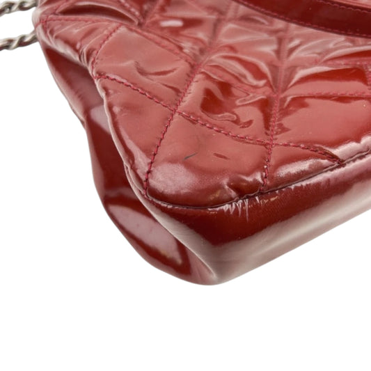 Chanel Timeless CC Soft Quilted
Leather Shopping Tote Bag in red patent leather with silver-tone hardware