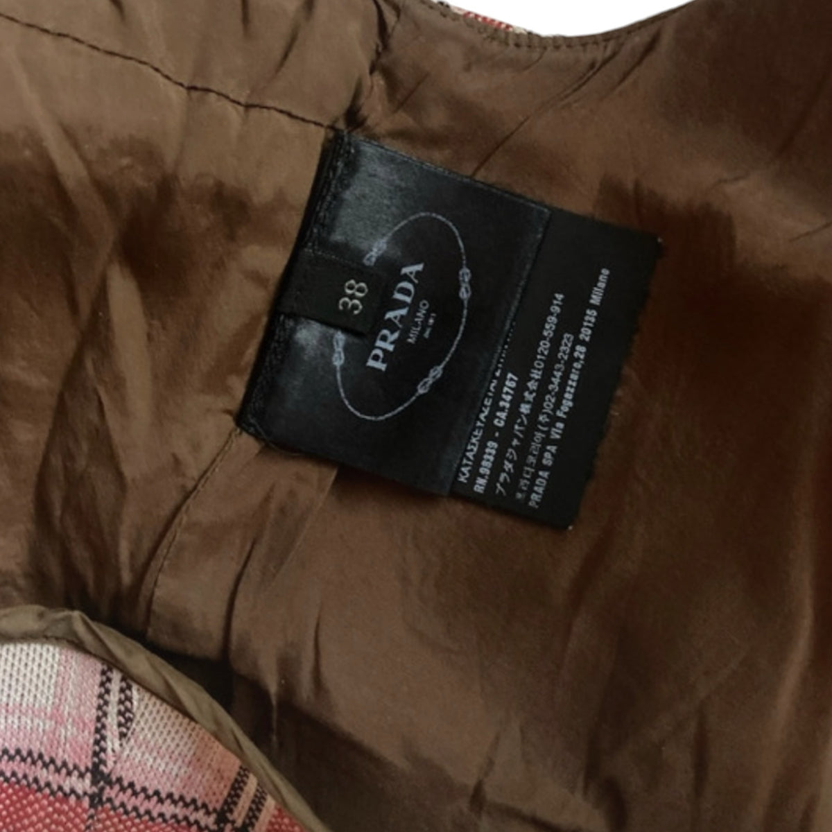 Fivedotsvintage Prada crop top interior label showing size 38 and brown lining detail