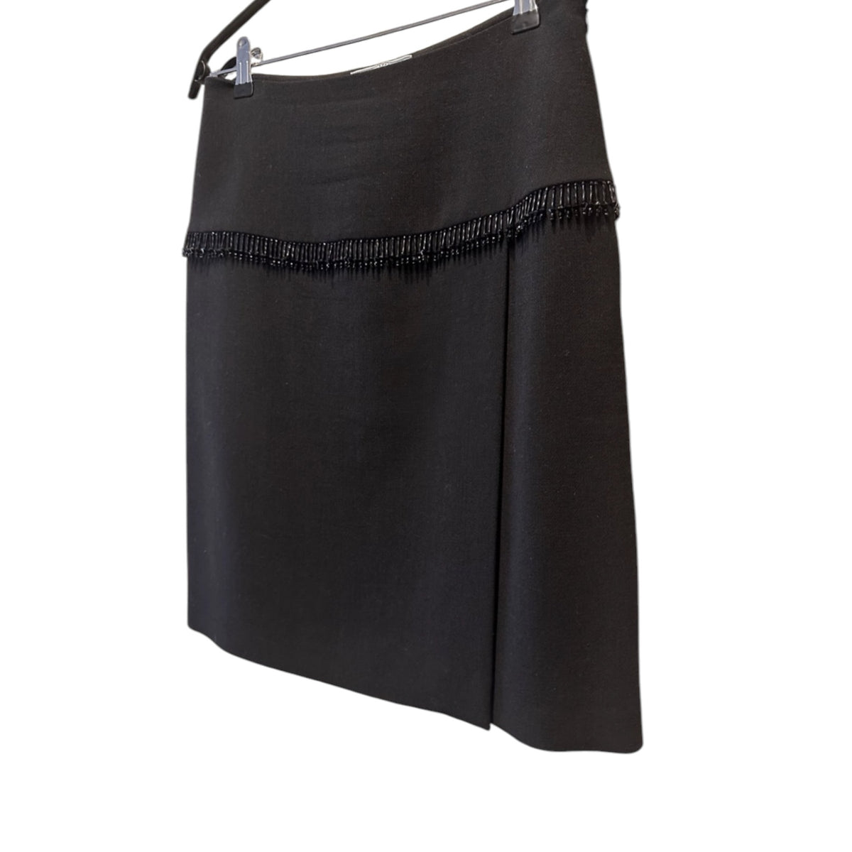 Fivedotsvintage black Prada mini skirt featuring a structured silhouette and delicate tonal beaded fringe detail.