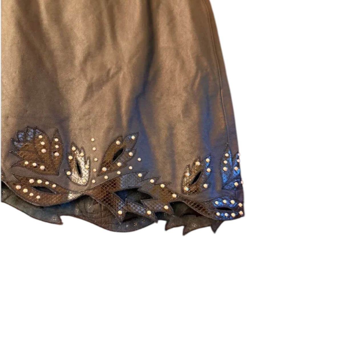 Fivedotsvintage dark brown lambskin leather mini skirt with a scalloped hem, python-embossed details, and metal studs.