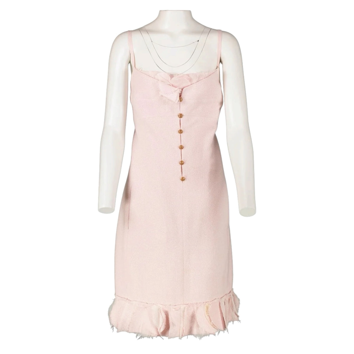 Fivedotsvintage Chanel pastel pink tweed mini dress with spaghetti straps, gold CC buttons, and a ruffled hem.