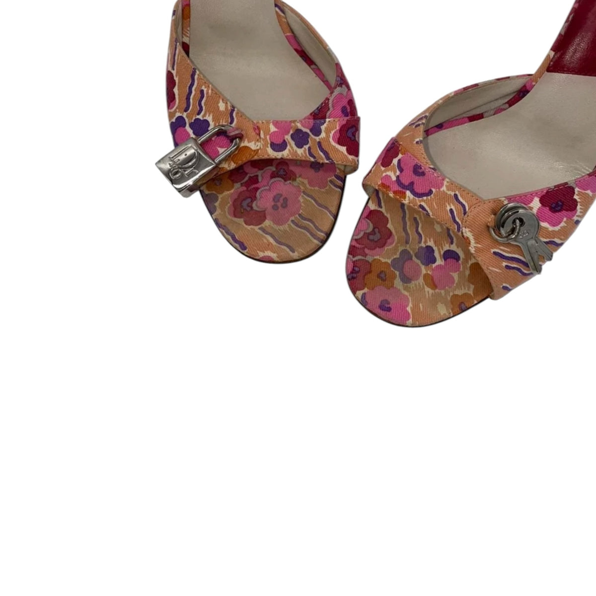 Fivedotsvintage Christian Dior floral fabric mules with silver-tone padlock and key hardware details.