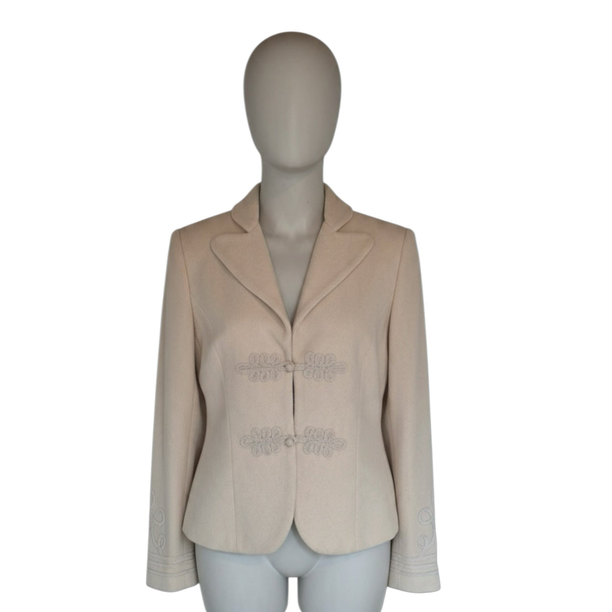 Fivedotsvintage cream wool blend blazer with decorative toggle closures and intricate cuff embroidery on a mannequin