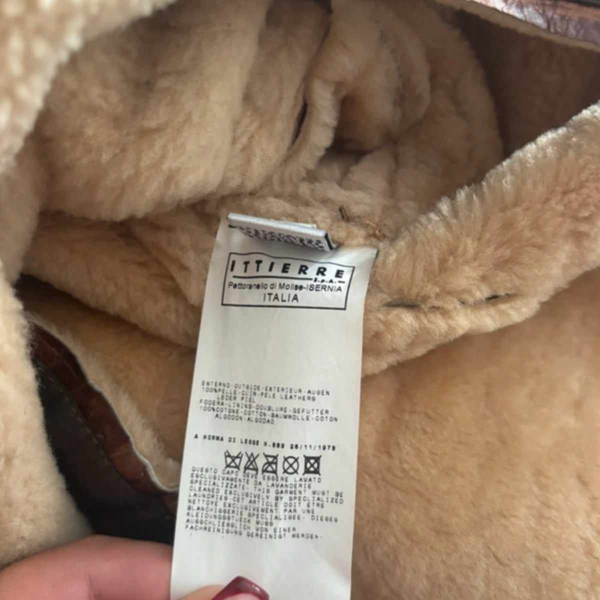Fivedotsvintage Dolce & Gabbana leather jacket interior label showing shearling lining and Italian care instructions