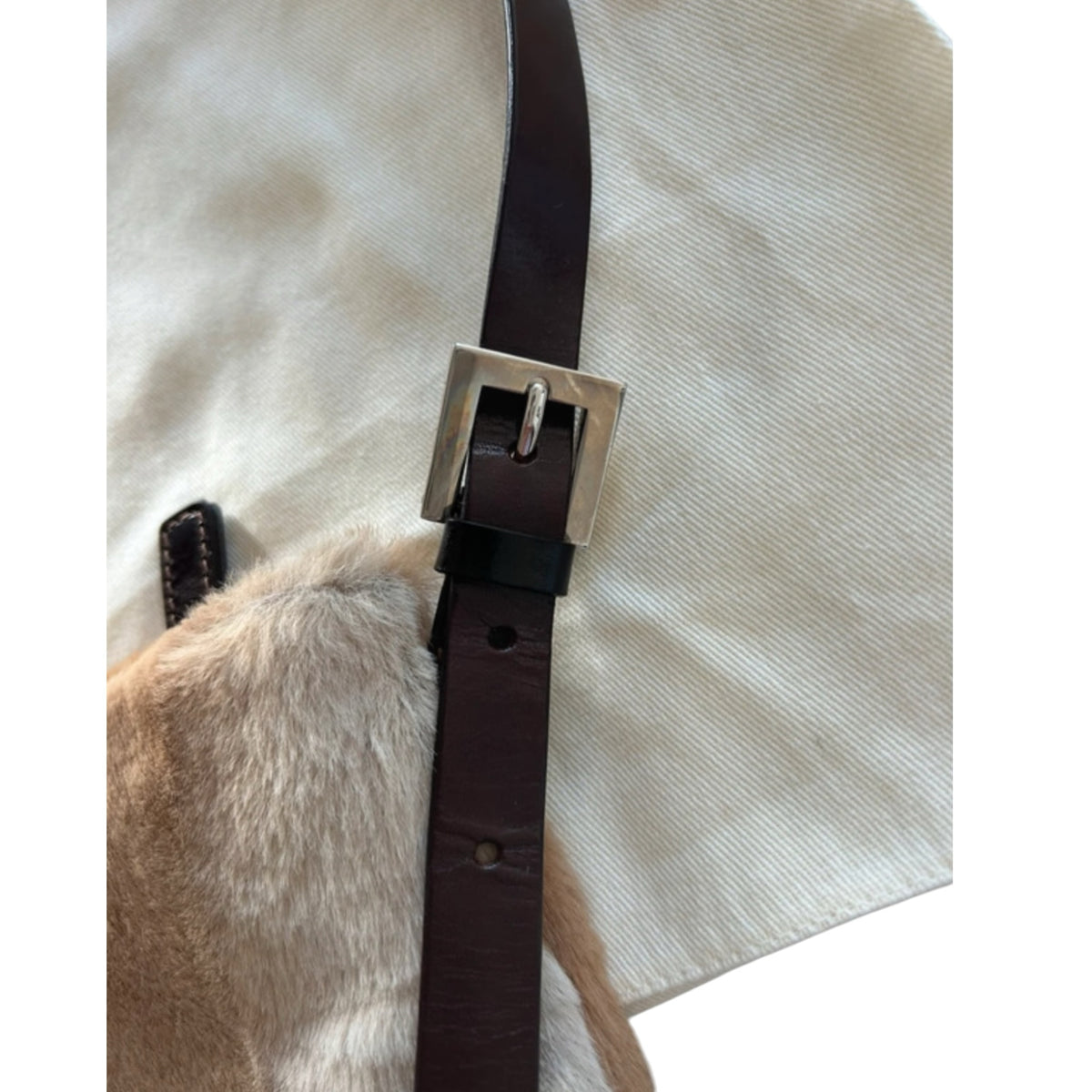 Fivedotsvintage Fendi shoulder bag featuring soft beige fur, dark brown leather strap, and silver buckle hardware.