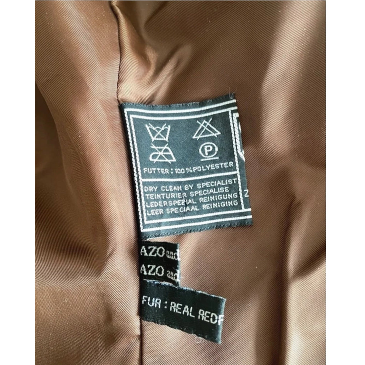 Fivedotsvintage leather jacket interior care label showing polyester lining and real fur material details