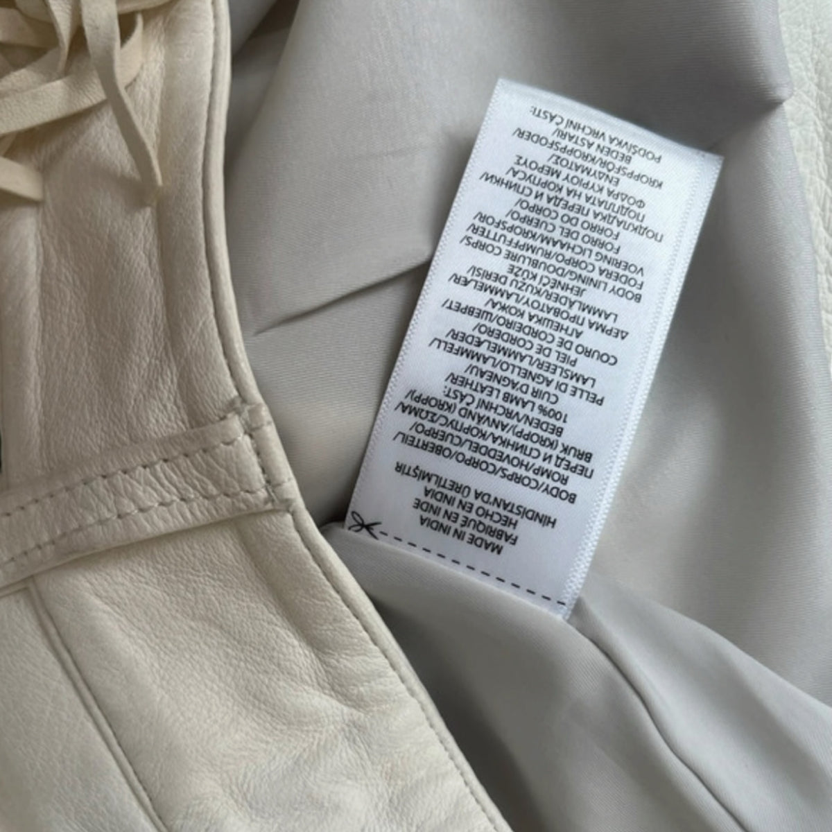 Fivedotsvintage Polo Ralph Lauren off-white lamb leather trousers care label showing material and origin details