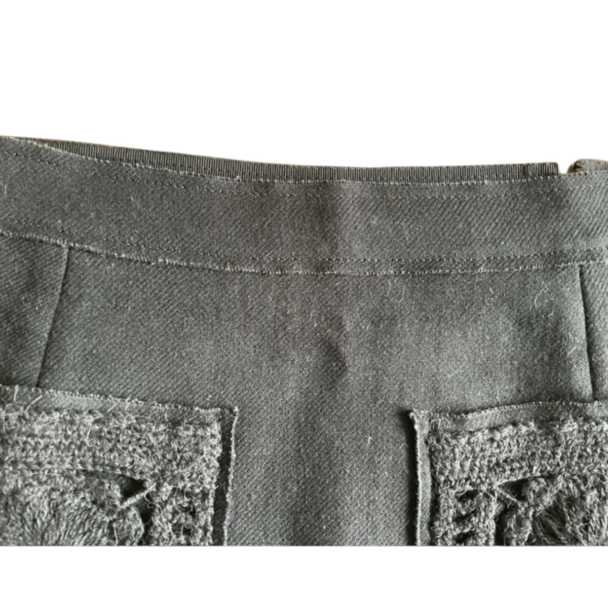Fivedotsvintage Prada charcoal wool mini skirt featuring front patch pockets with intricate hand-finished crochet detail