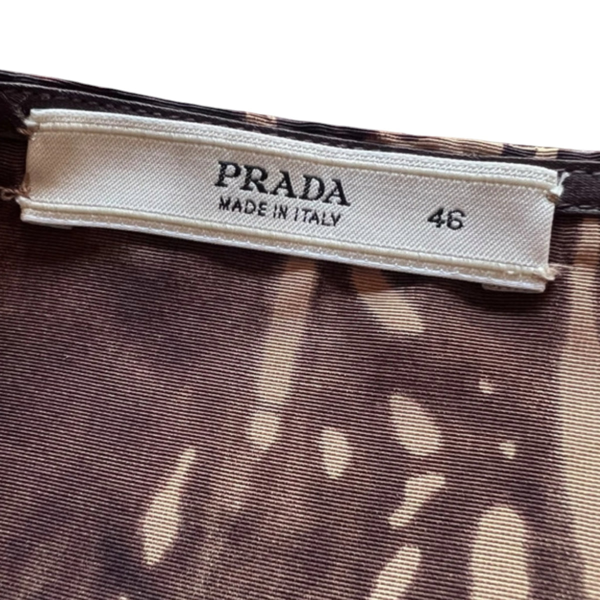 Fivedotsvintage Prada vintage silk skirt label showing Made in Italy and size 46 on brown abstract print fabric