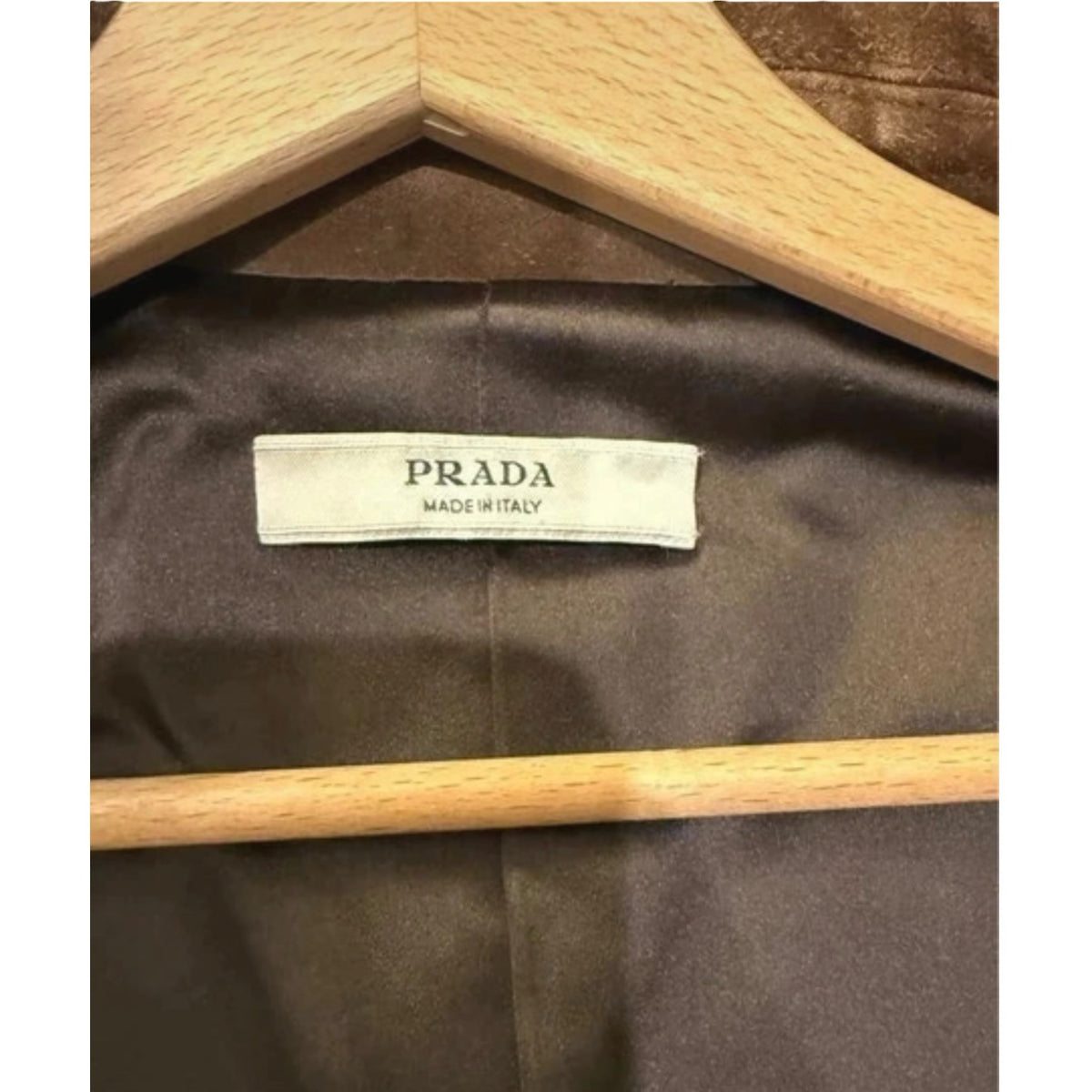 Fivedotsvintage Prada vintage suede coat interior label showing Prada Made in Italy branding on smooth brown lining