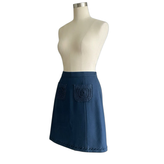 Fivedotsvintage Prada charcoal wool mini skirt with front crochet patch pockets and decorative hem stitching.