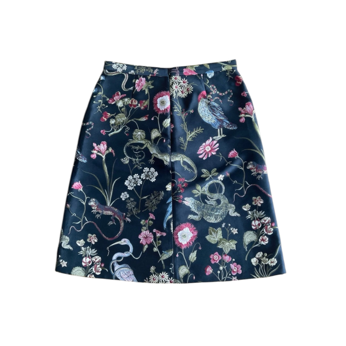 Fivedotsvintage RED Valentino A-line mini skirt in dark fabric with colourful floral, bird, and reptile jacquard print.