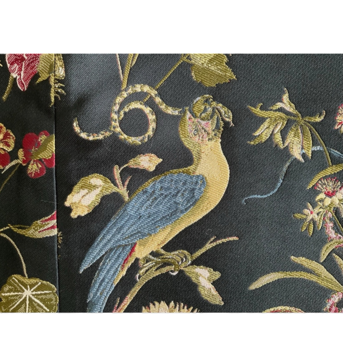 Fivedotsvintage RED Valentino mini skirt featuring a dark jacquard fabric with intricate bird and floral embroidery.