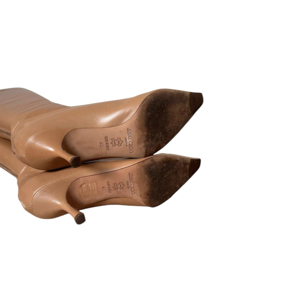 Fivedotsvintage Jimmy Choo tan leather knee-high boots with pointed toes and kitten heels, showing soles.