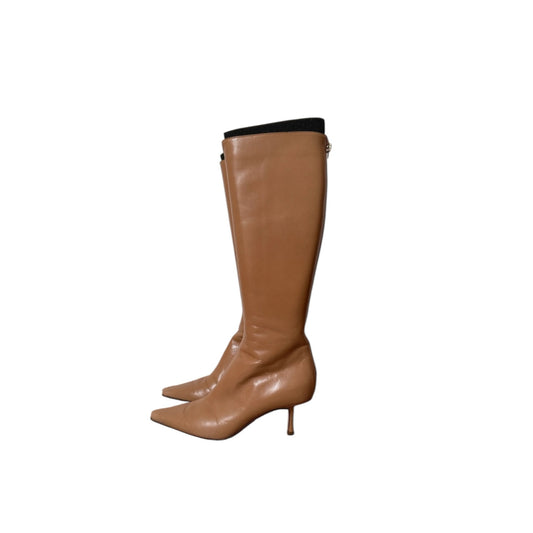 Fivedotsvintage tan leather knee-high boots with a pointed toe and kitten heel against a white background.
